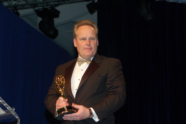Picture of Tyler Mathisen holding Emmy Award 